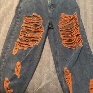AKIRA Denim Jeans with Vibrant Orange Rips